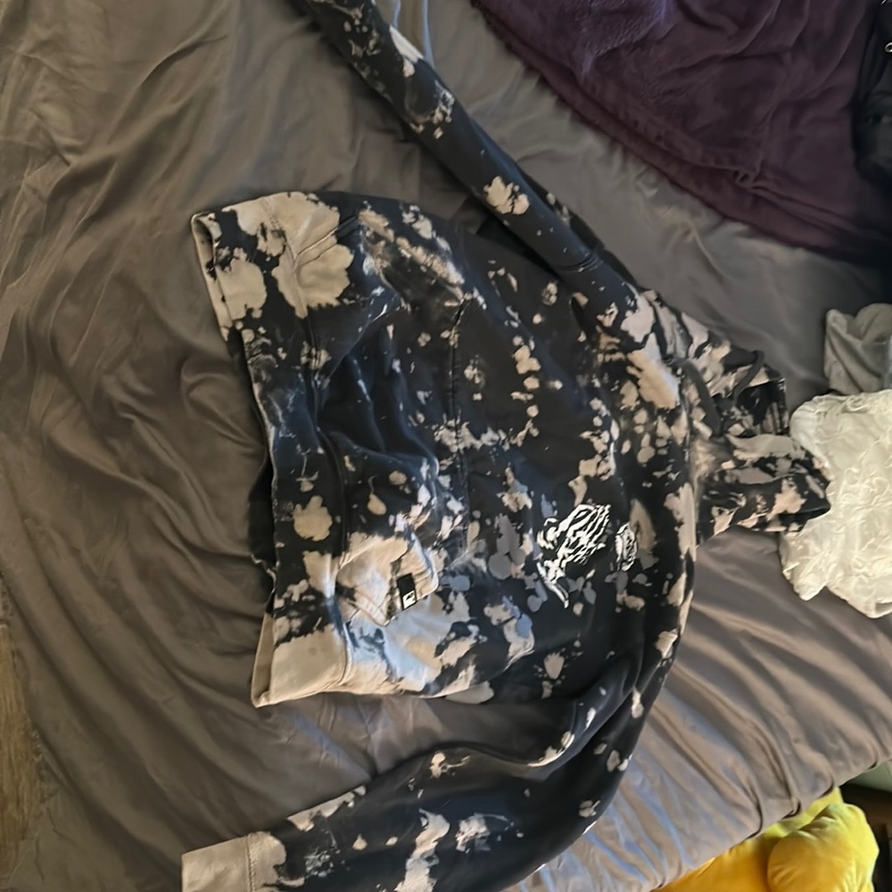 Black and bleached hoodie with praying hands and a rose.